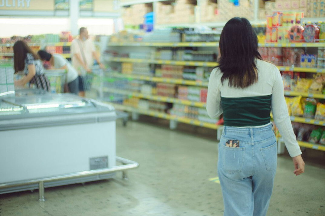 store detective watching shopper