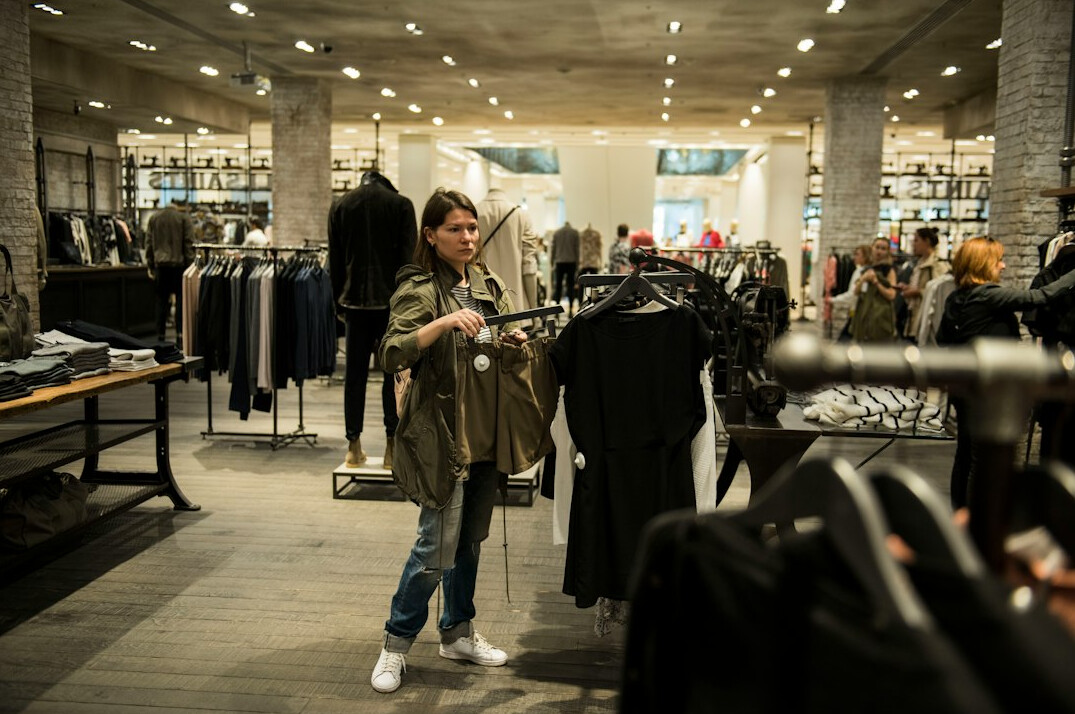 store detective watching shoppers