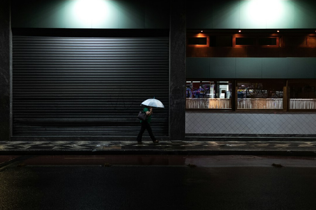 detective exiting store at night