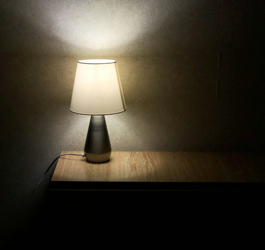 Writing desk with notebook and lamp